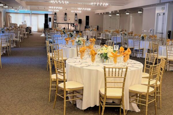 White and yellow corporate event decor at Mile Square Golf Course